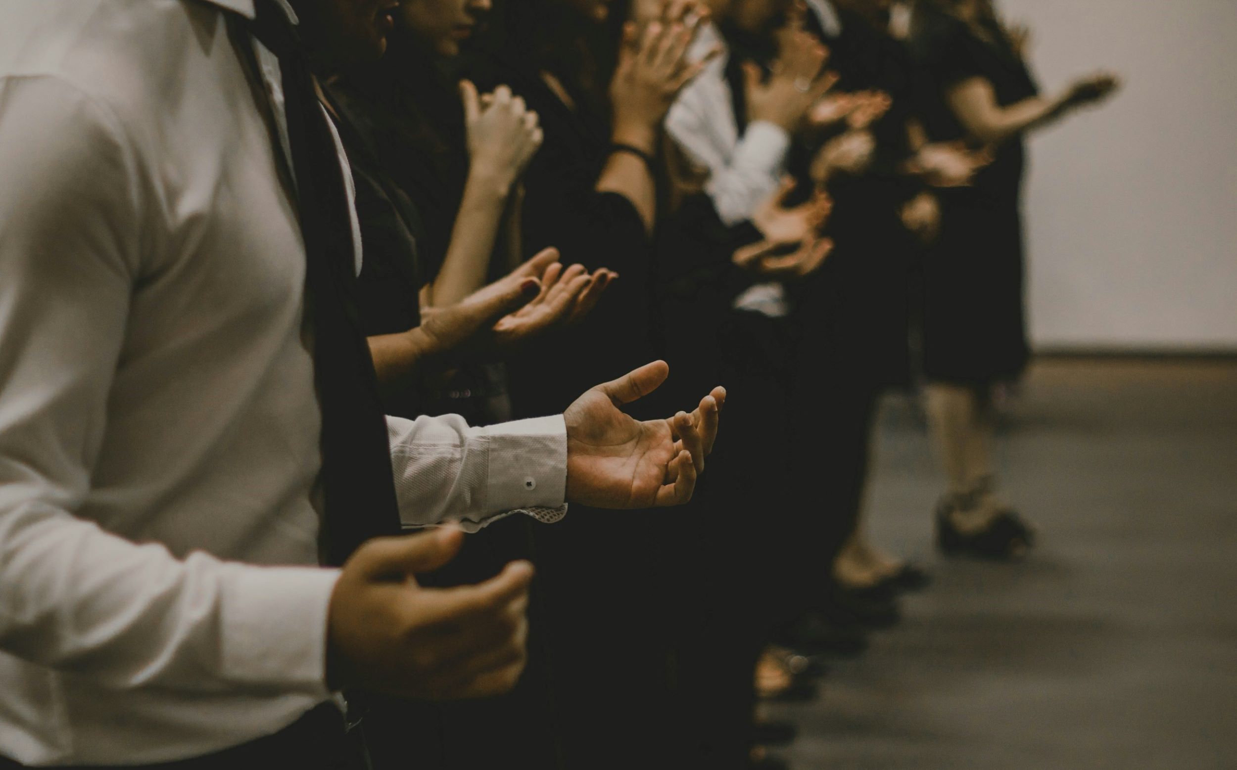 A small congregation gathers to pray together.