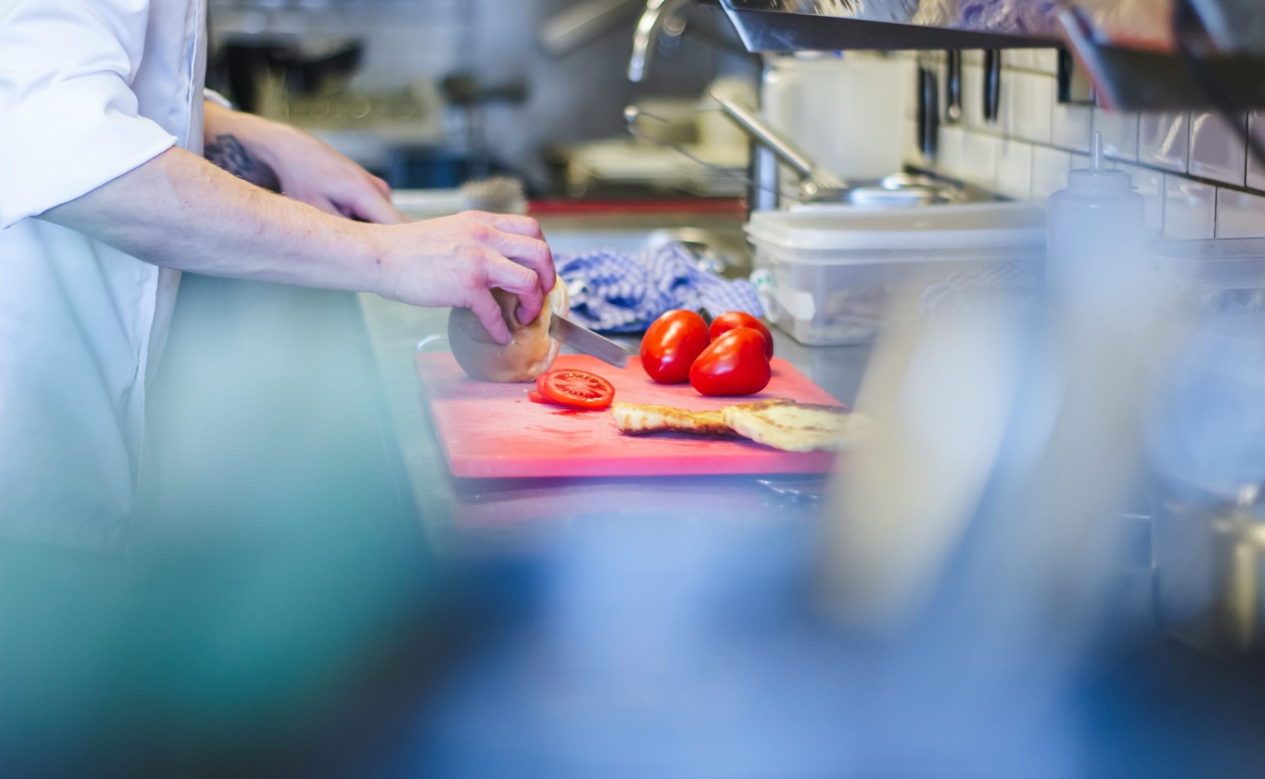 A chef prepares meals for customers.