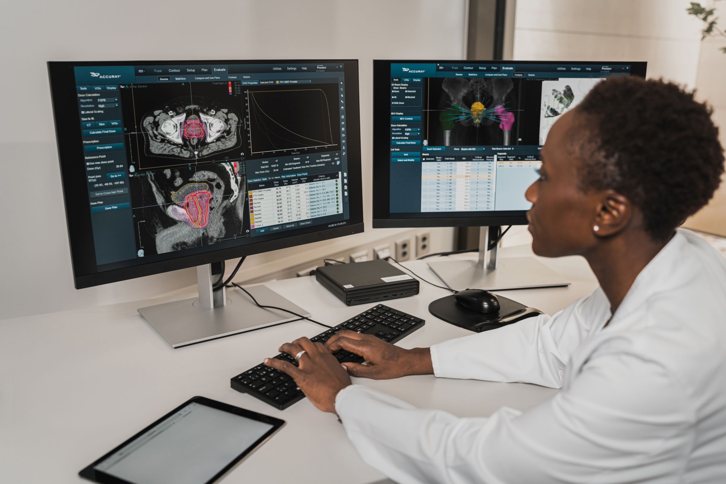 A doctor reviews data on a computer.