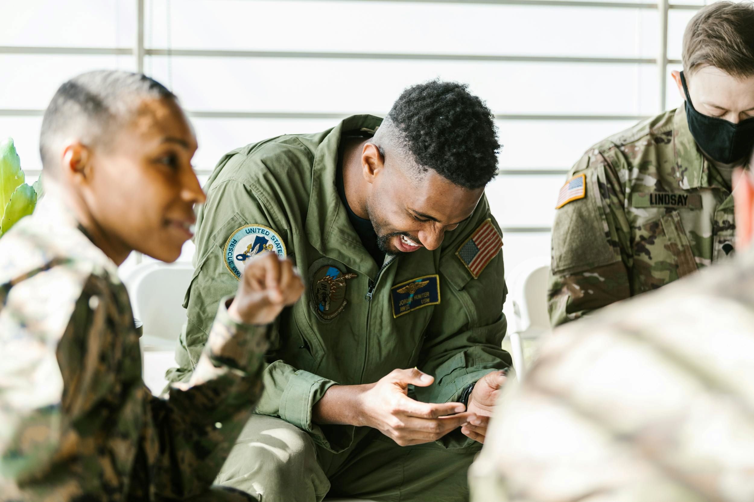 Members of the armed forces interact with each other.