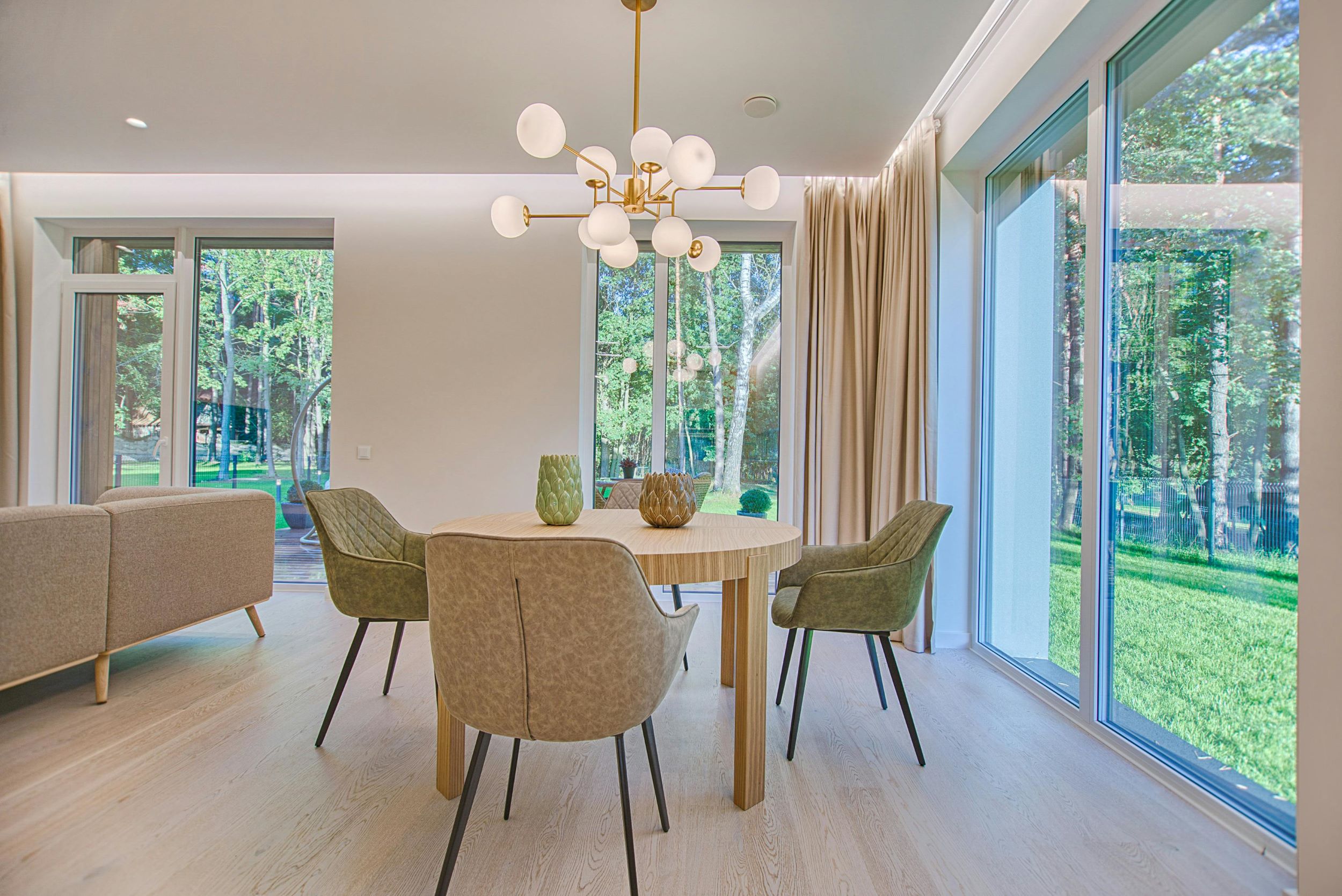 An interior image of a well-lit home with minimalist furniture.