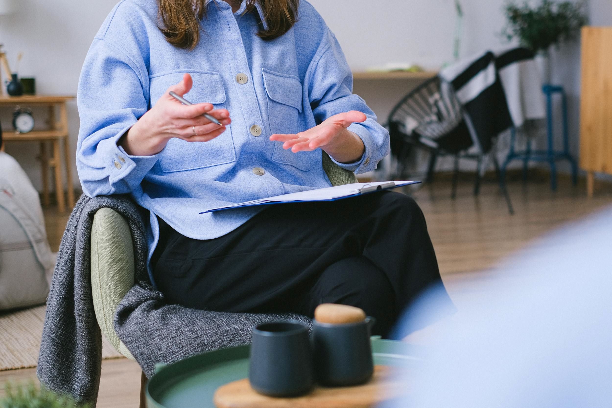 A practitioner speaks with her patient.