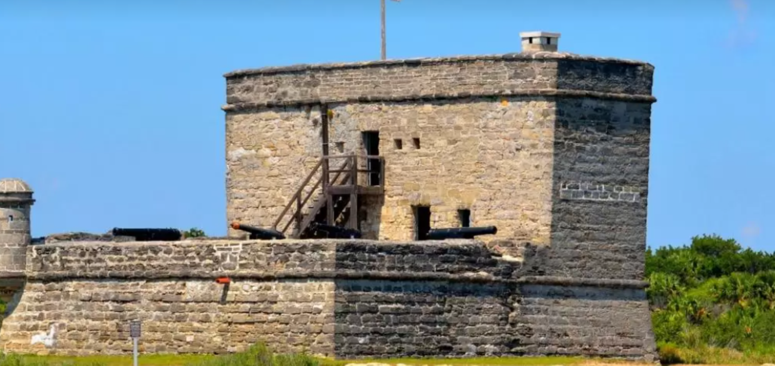 The coquina stone walls of Fort Matanzas gleam under the bright sun.