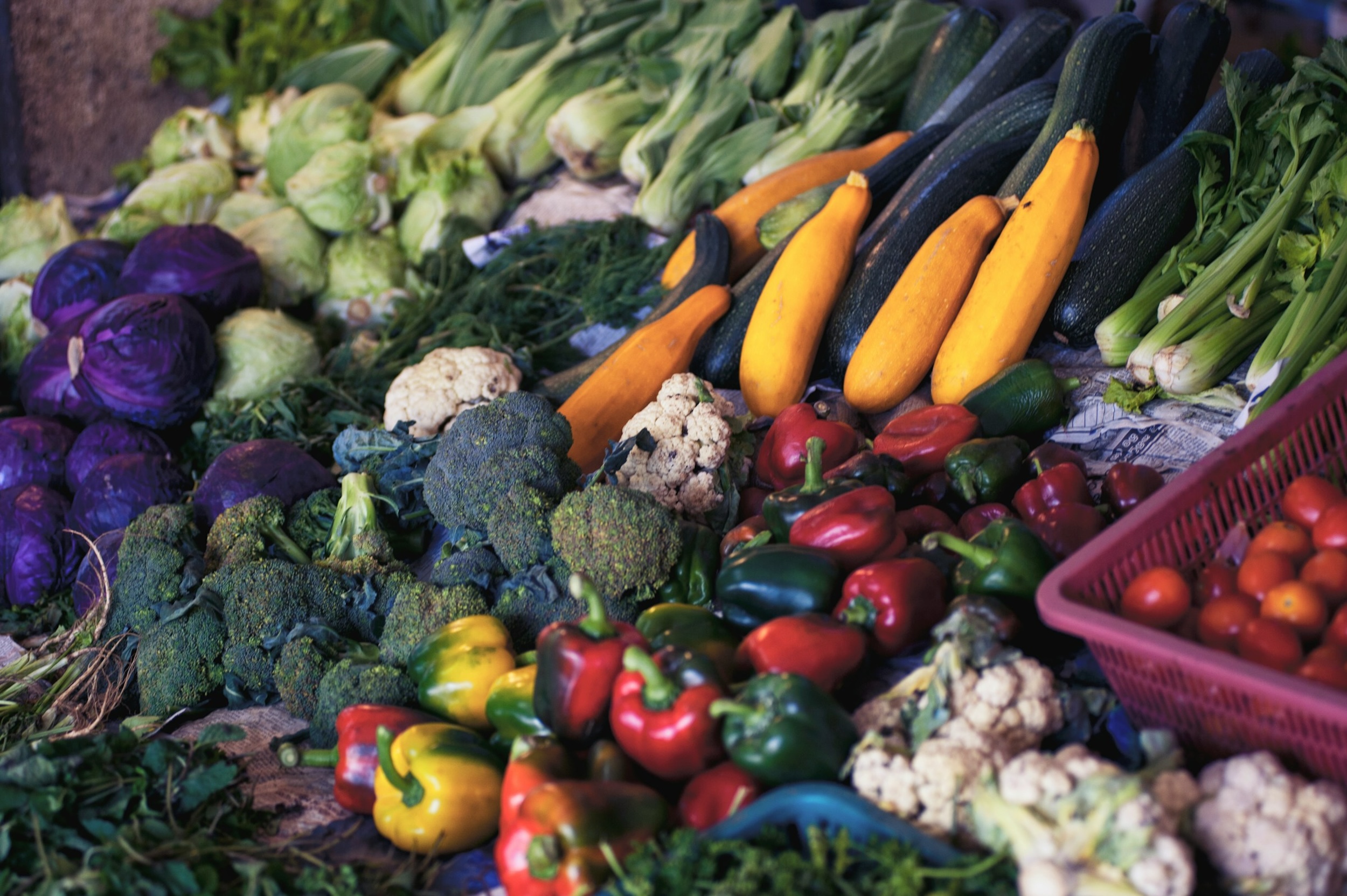Fresh produce is placed on display for customers.