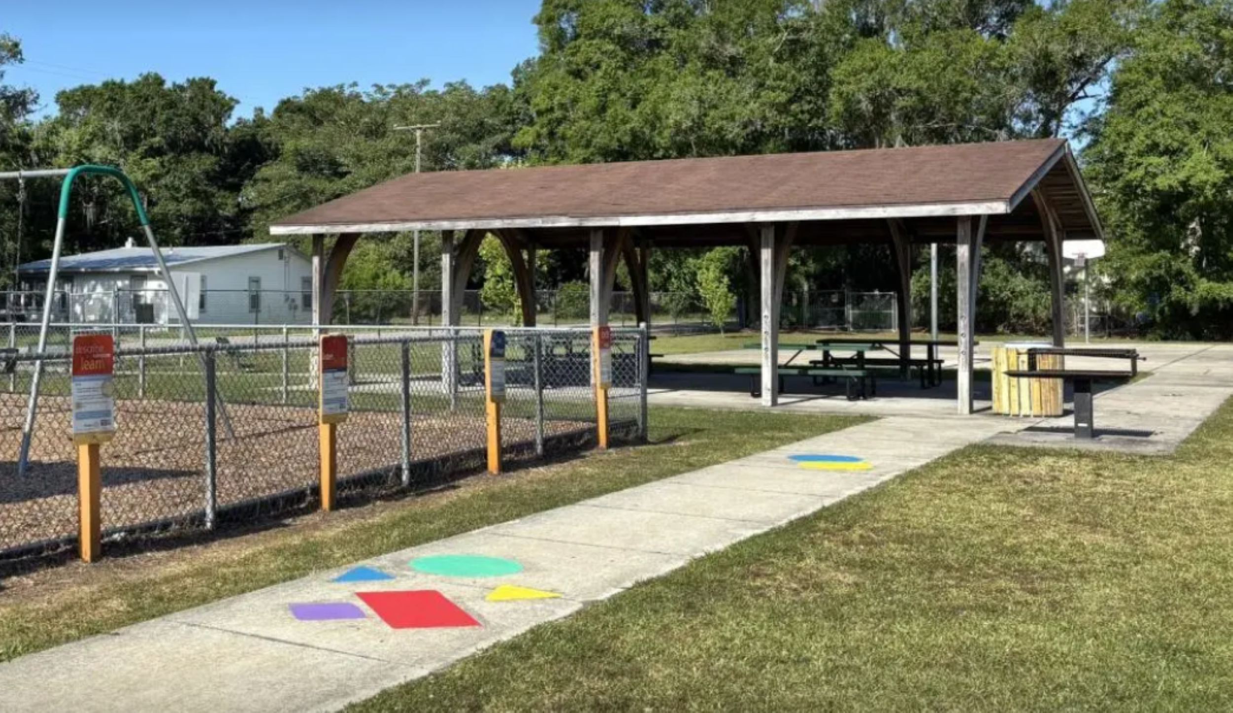 The W.E. Harris Community Center stands bright and inviting under the clear, sunny sky.