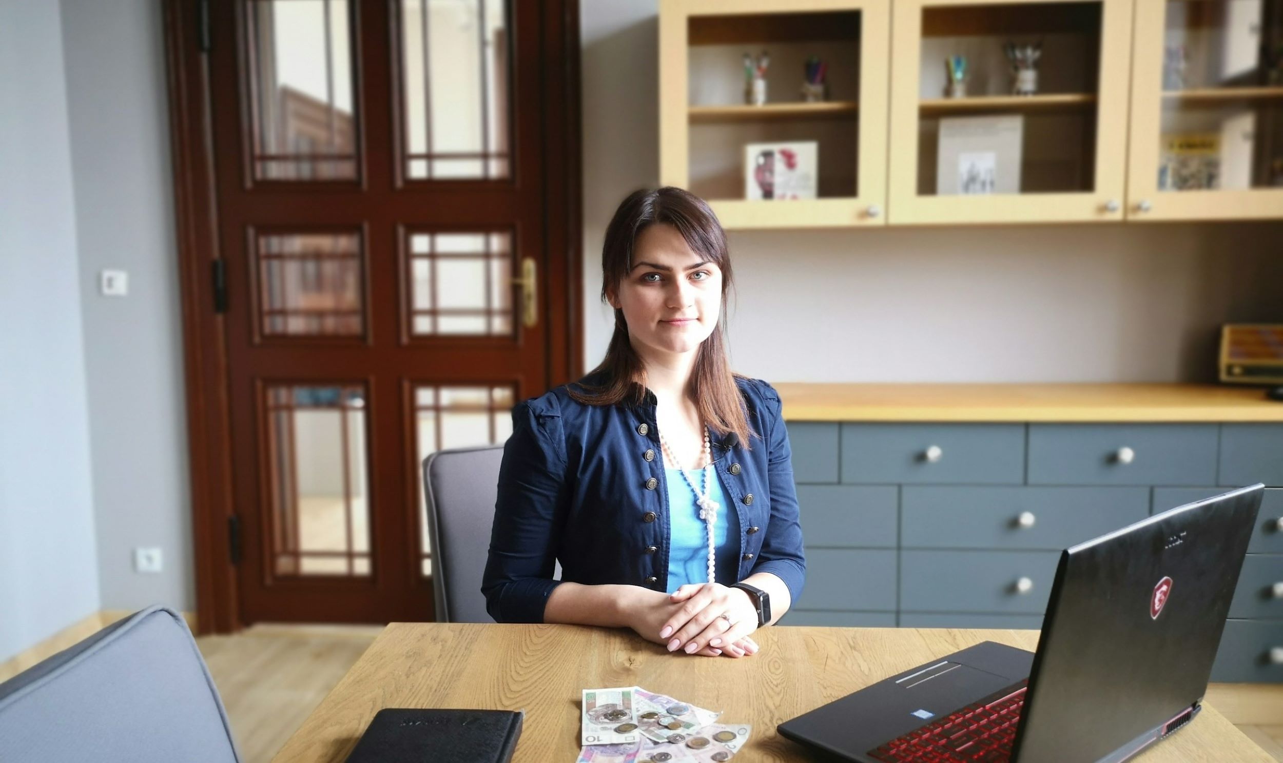 A case manager is seated at her desk.
