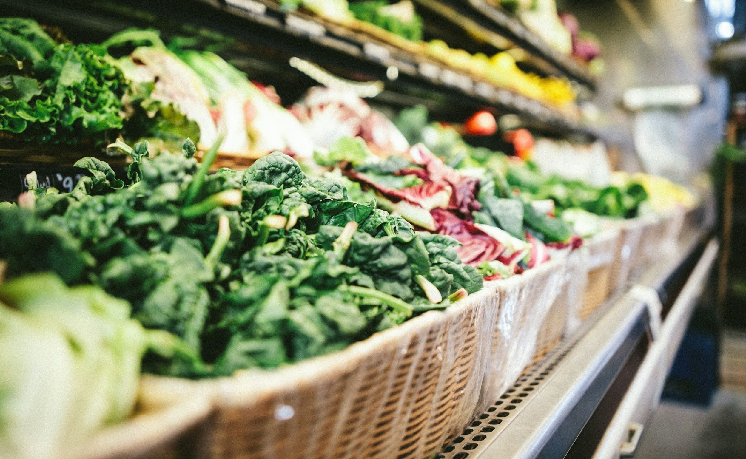 Vegetables are on display at a grocery store.