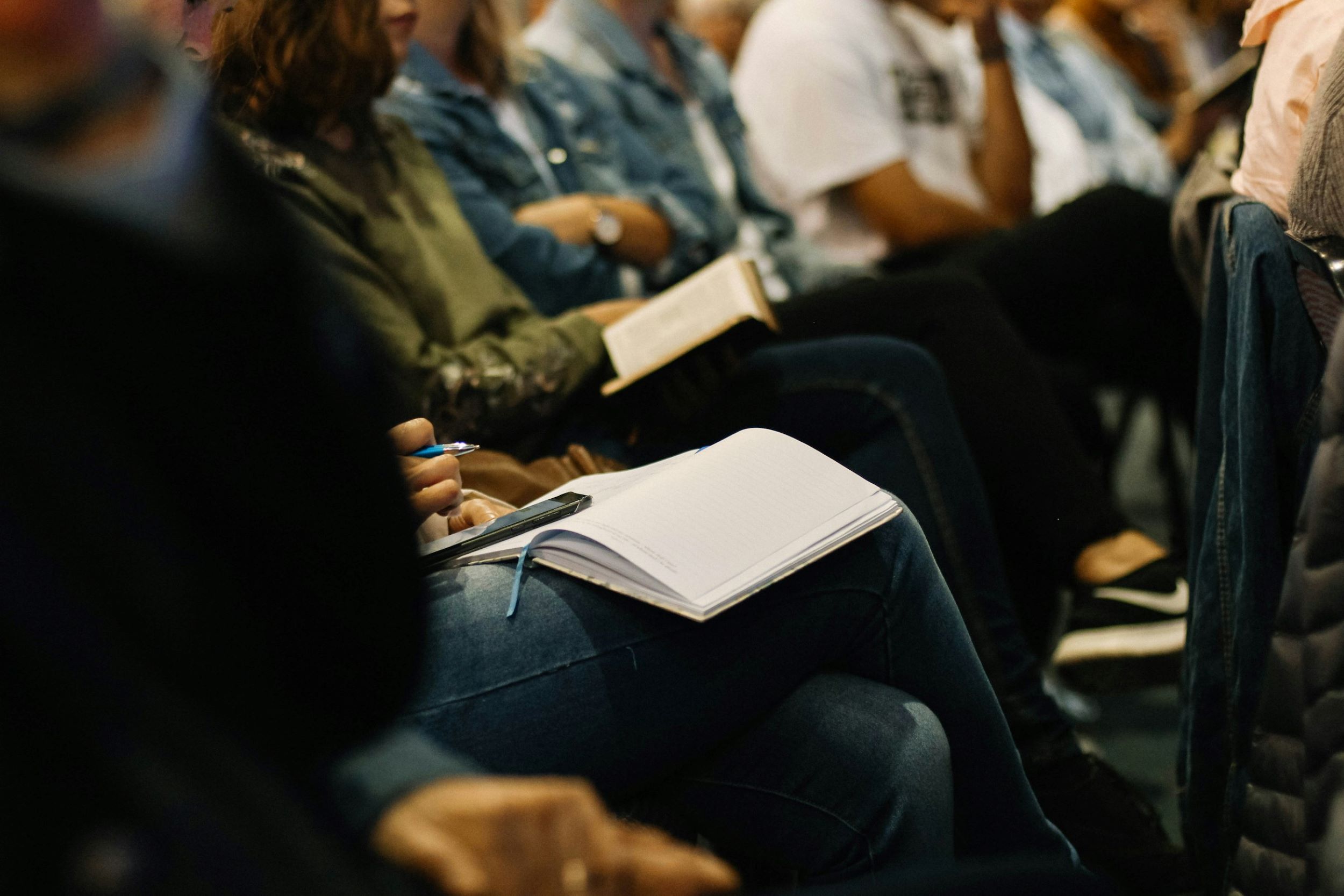 A group of students sit in a classroom.