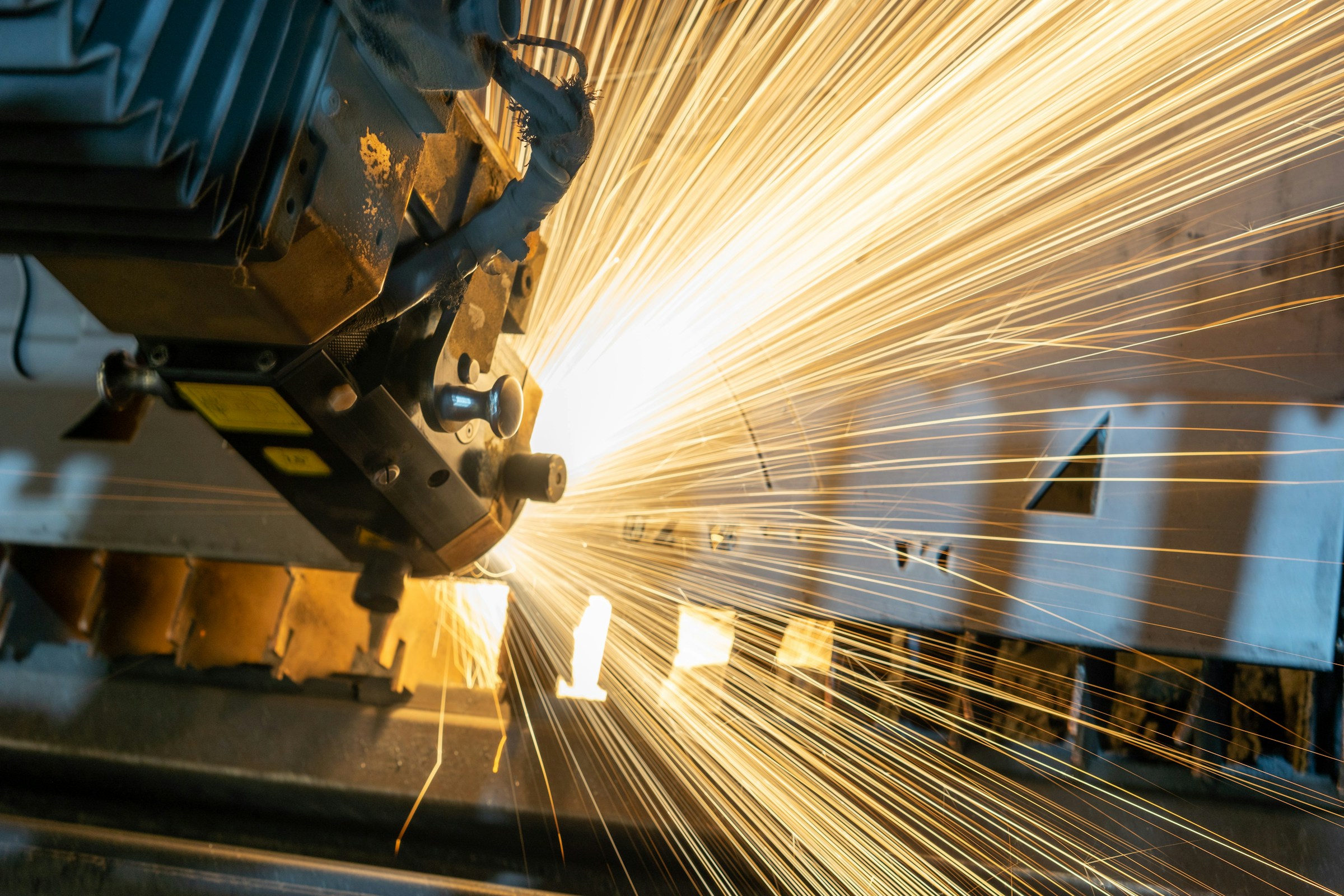 Sparks shoot from metal.