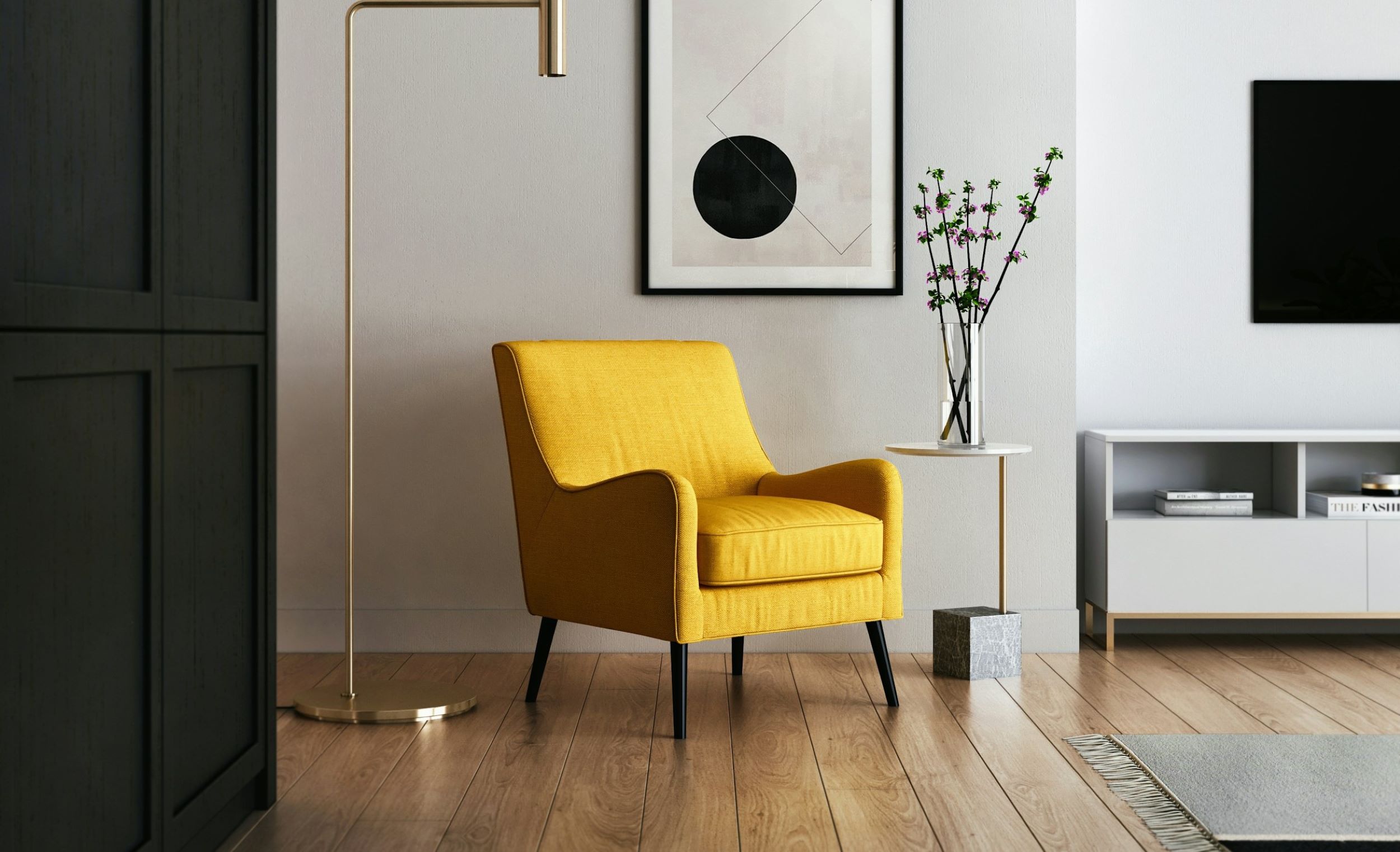 A bright yellow couch is positioned in a room with minimalist accents.